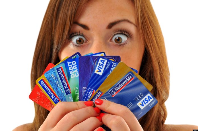 Credit cards, woman holding lots of credit and debit cards. Image shot 09/2010. Exact date unknown. credit cards for bad credit